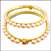 Click here for more on PEACH OVAL PEARL BANGLES - SJPDBL004